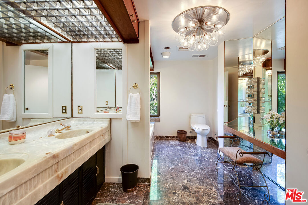 3572 Multiview Drive Los Angeles, CA 90068 - Photo 33 of 51 a bathroom with a sink and a mirror