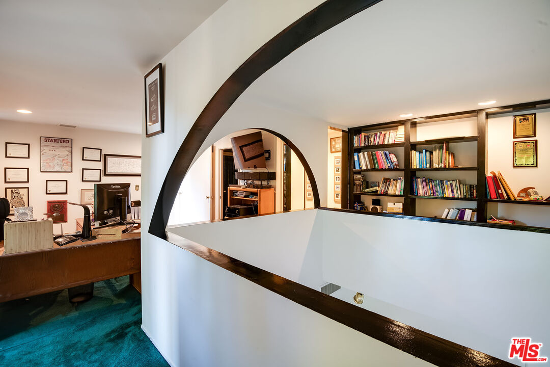3572 Multiview Drive Los Angeles, CA 90068 - Photo 37 of 51 a living room with lots of furniture and a book shelf