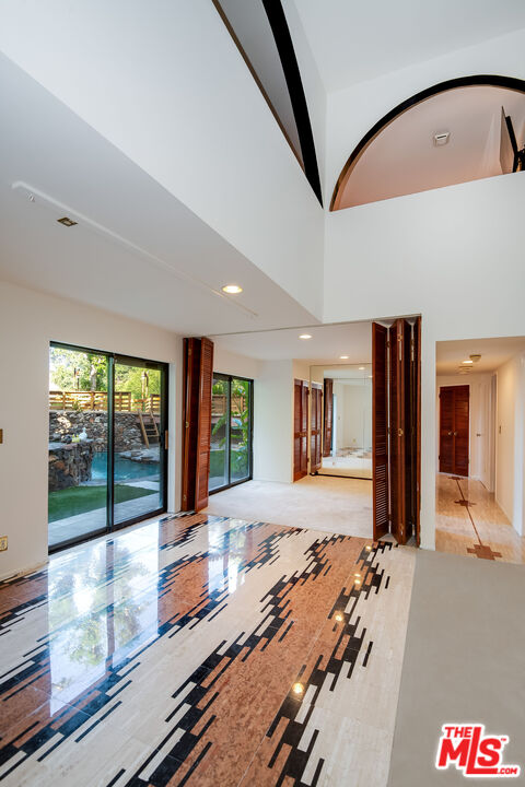 3572 Multiview Drive Los Angeles, CA 90068 - Photo 38 of 51 a bed room with a bed and a large window