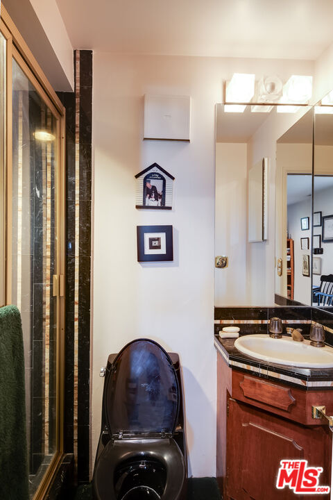 3572 Multiview Drive Los Angeles, CA 90068 - Photo 39 of 51 a bathroom with a sink and a mirror