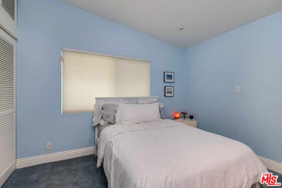 3572 Multiview Drive Los Angeles, CA 90068 - Photo 40 of 51 a bedroom with a bed and a window