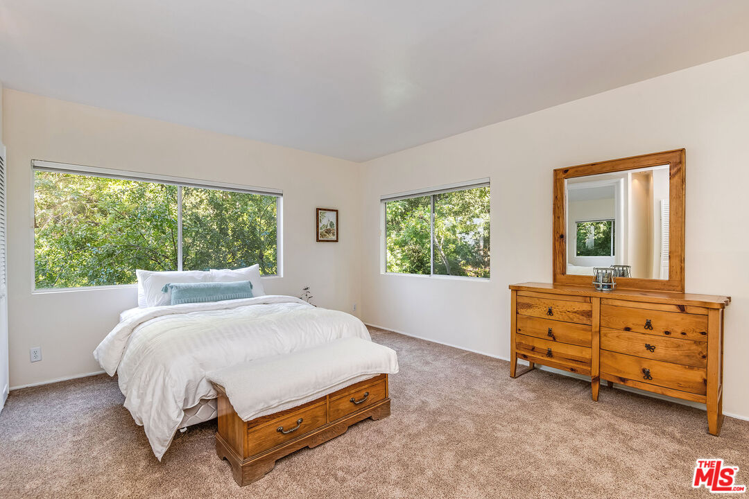 3572 Multiview Drive Los Angeles, CA 90068 - Photo 42 of 51 a bed sitting in a bedroom next to a window