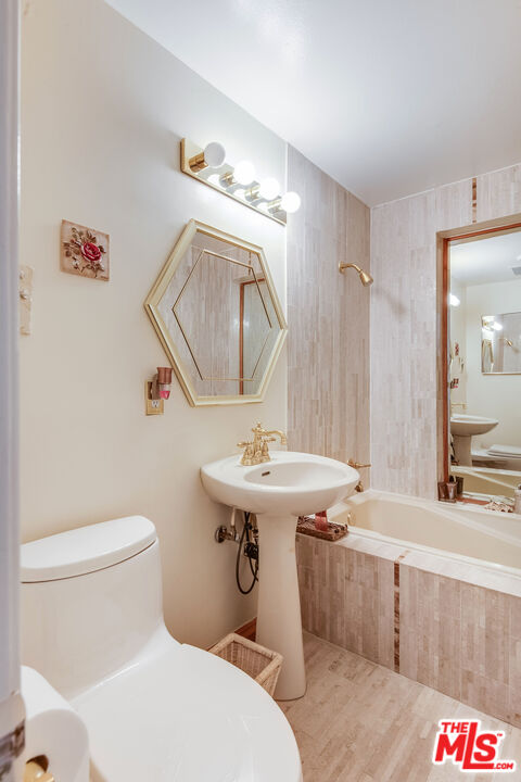 3572 Multiview Drive Los Angeles, CA 90068 - Photo 48 of 51 a bathroom with a sink a toilet and a mirror