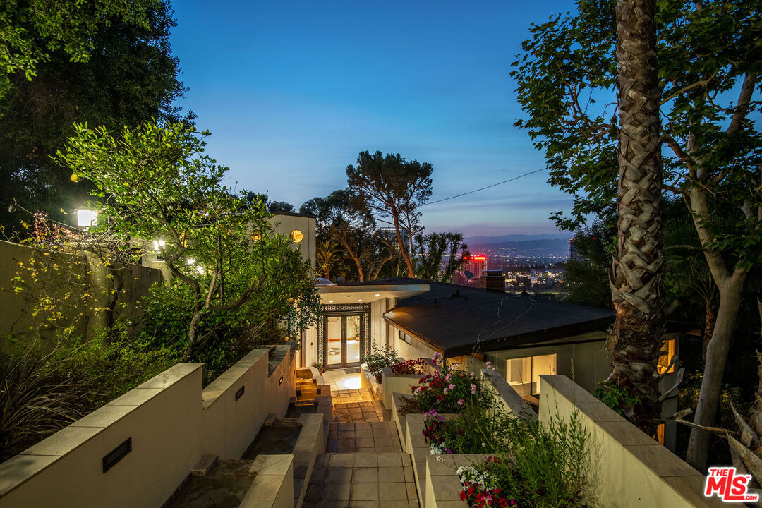 3572 Multiview Drive Los Angeles, CA 90068 - Photo 5 of 51 a view of a balcony with wooden floor and outdoor seating