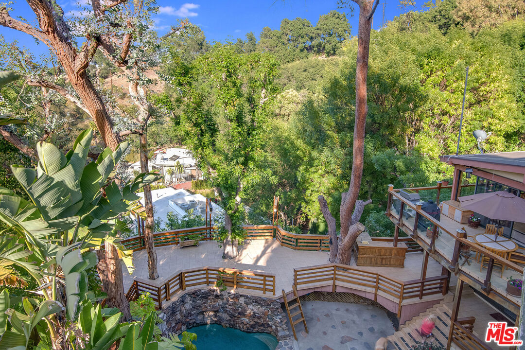 3572 Multiview Drive Los Angeles, CA 90068 - Photo 51 of 51 a view of a patio with table and chairs and potted plants