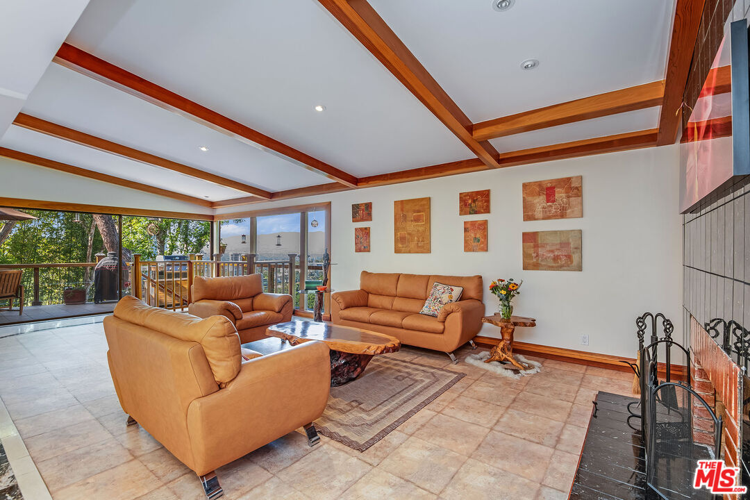 3572 Multiview Drive Los Angeles, CA 90068 - Photo 7 of 51 a living room with furniture and a floor to ceiling window