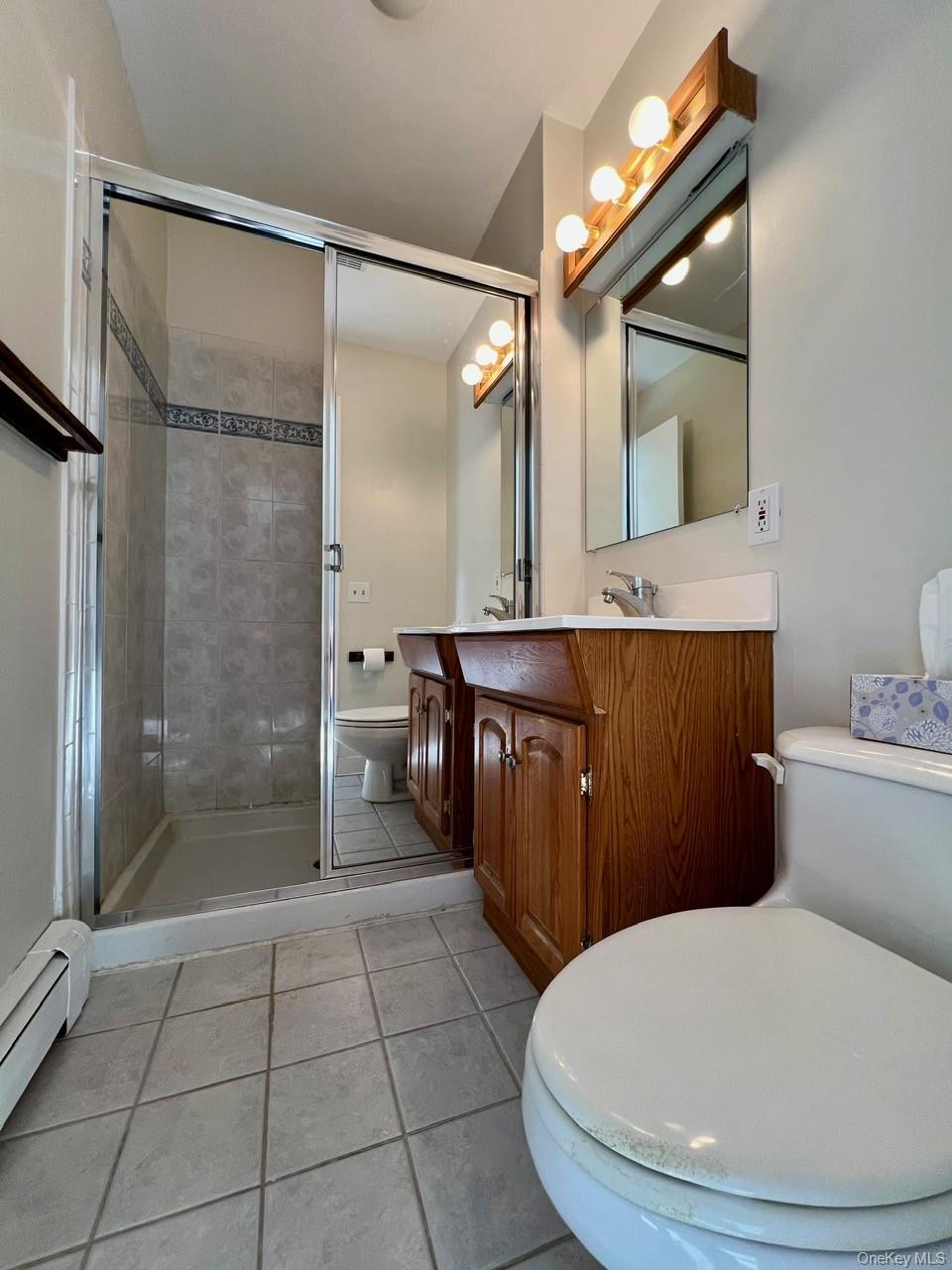 9 Loudon Drive, Unit 6 Fishkill, NY 12524 - Photo 14 of 16 a bathroom with a sink a toilet and shower