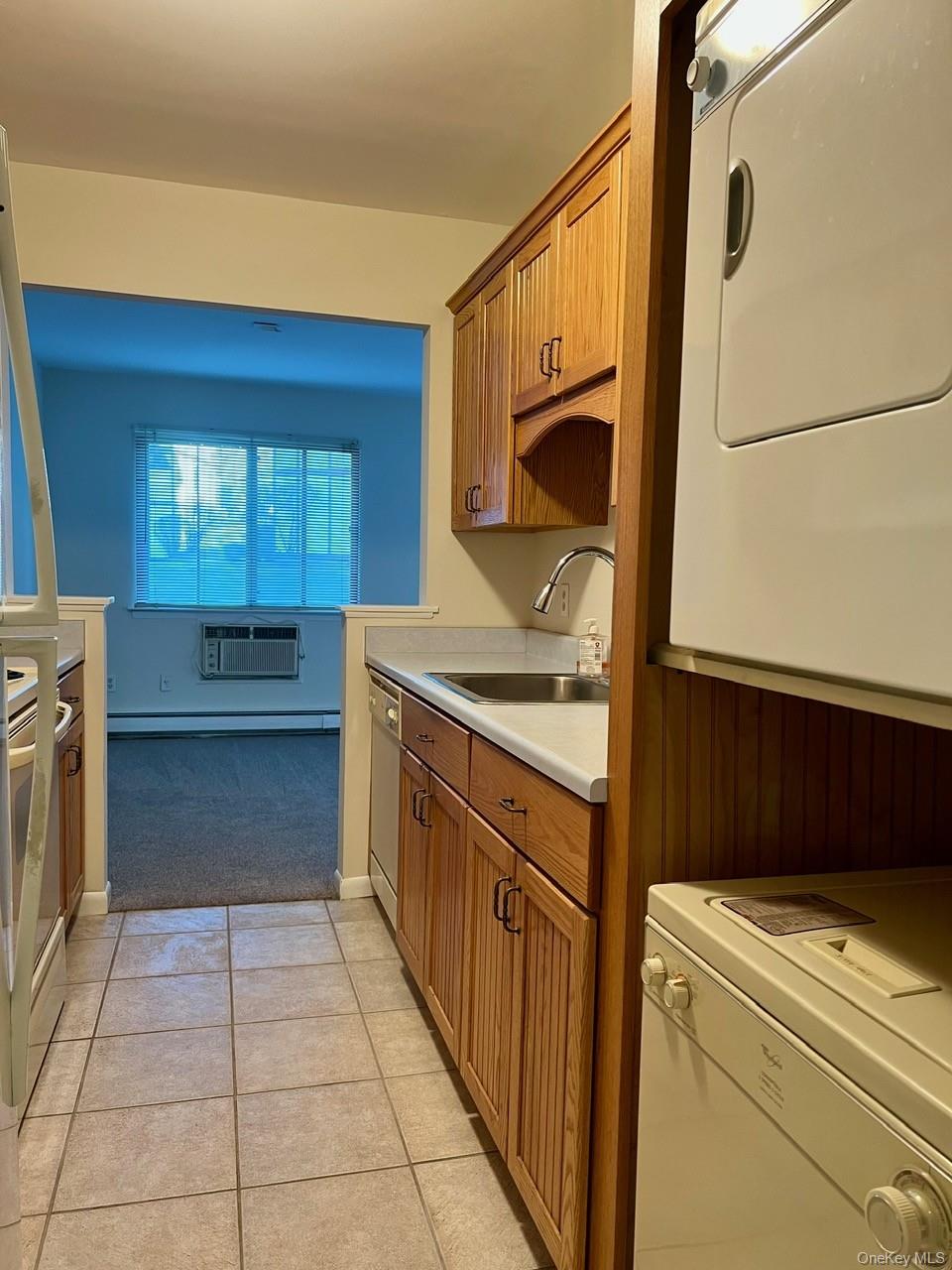 9 Loudon Drive, Unit 6 Fishkill, NY 12524 - Photo 3 of 16 a bathroom with a sink a washer and dryer