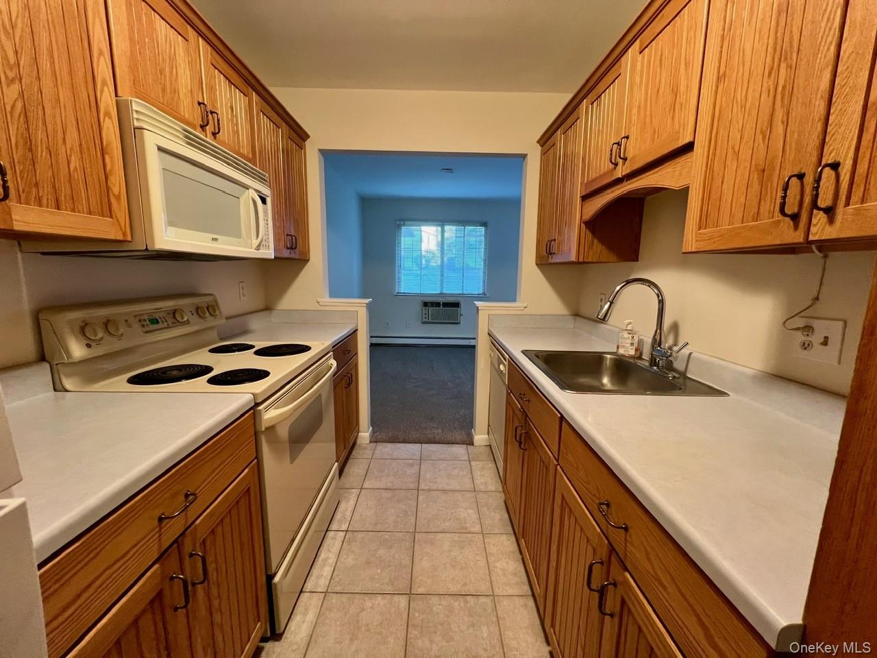 9 Loudon Drive, Unit 6 Fishkill, NY 12524 - Photo 4 of 16 a kitchen with a sink stove top oven and cabinets
