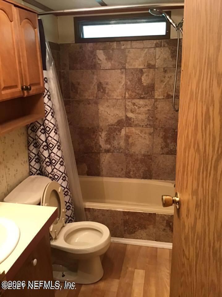 218 Violet Avenue Interlachen, FL 32148 - Photo 7 of 7 a bathroom with a toilet and a shower