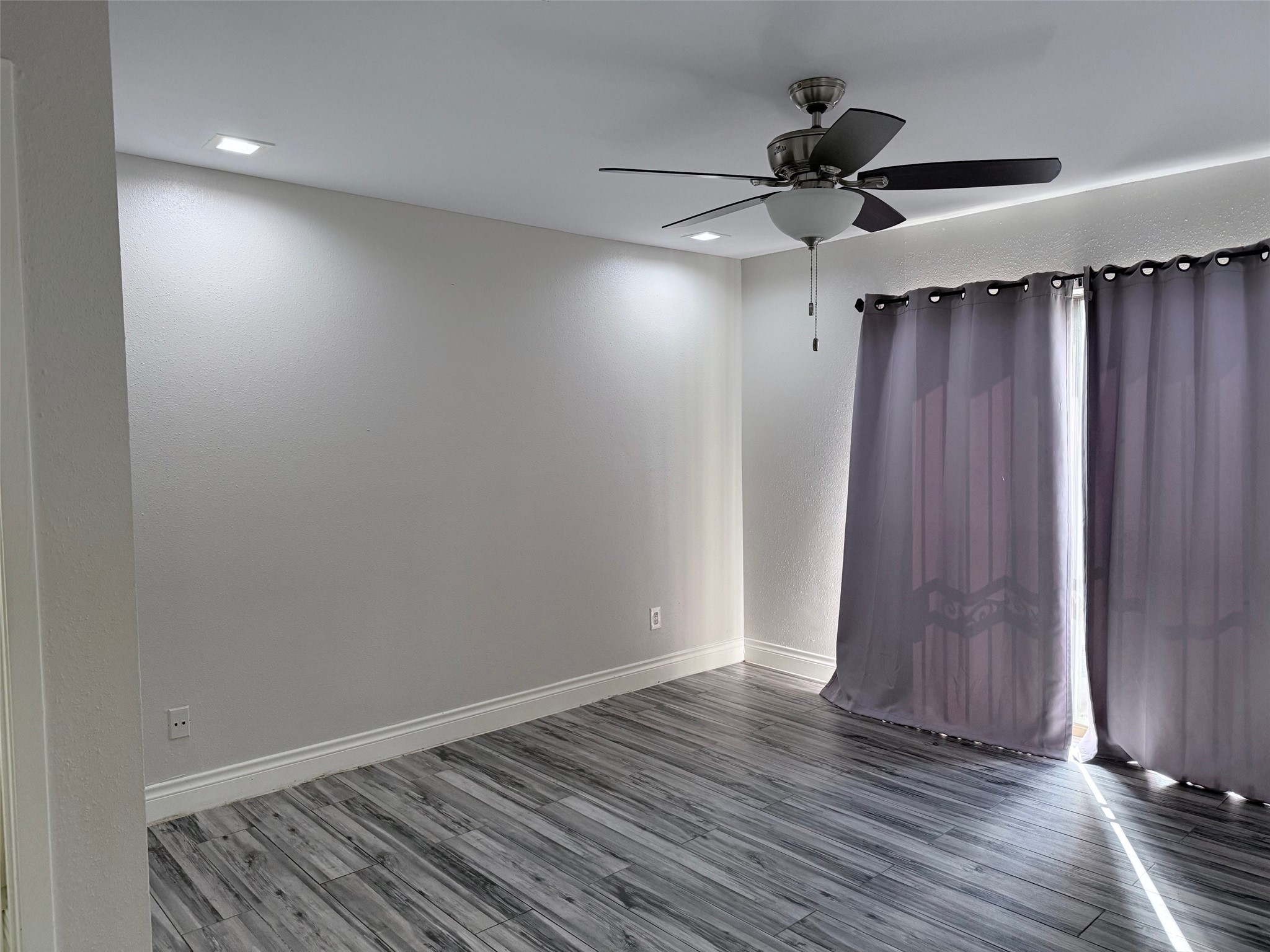 6701 Sands Point Drive, Unit 48 Houston, TX 77074 - Photo 12 of 30 wooden floor in an empty room
