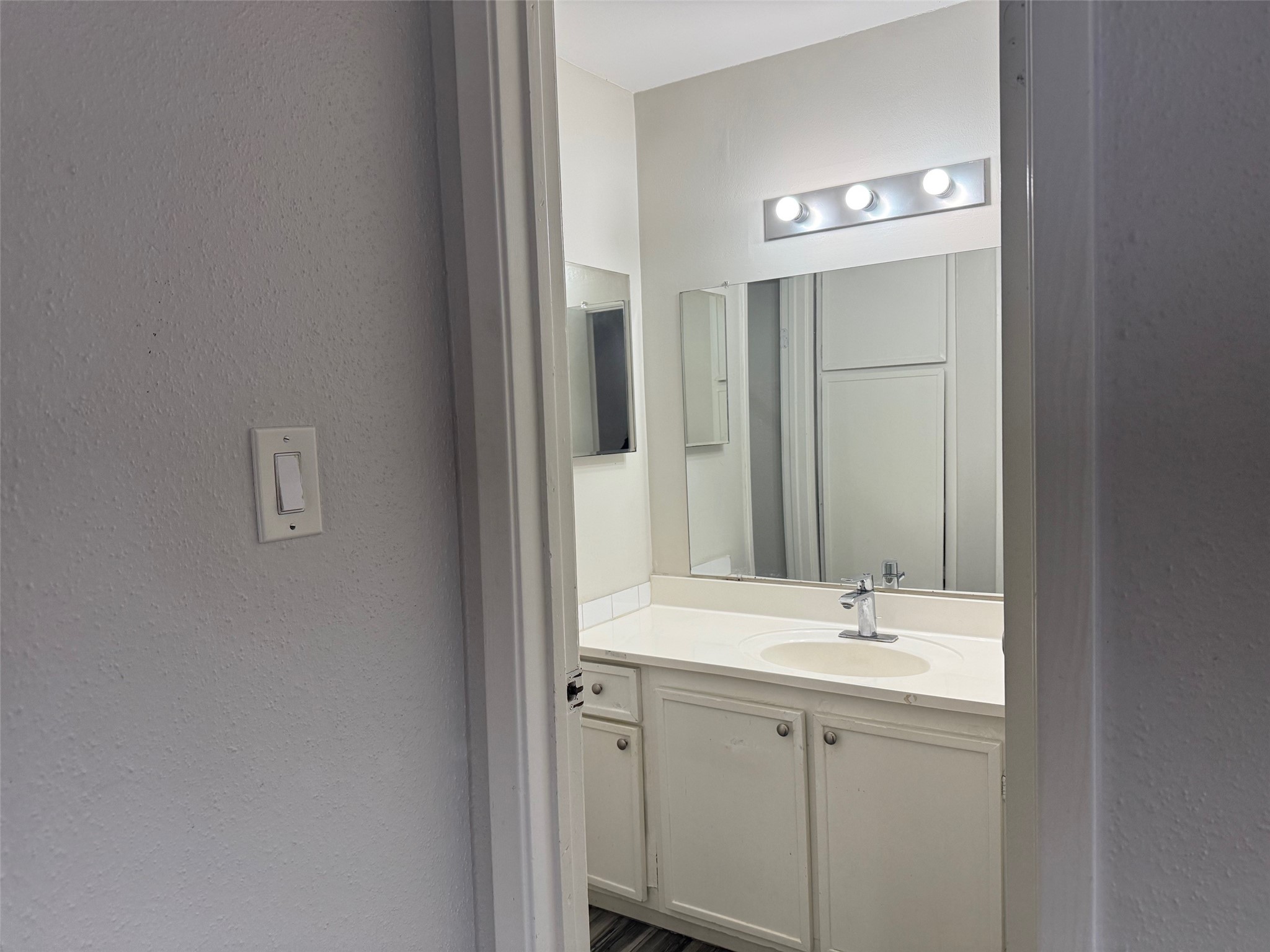 6701 Sands Point Drive, Unit 48 Houston, TX 77074 - Photo 13 of 30 a bathroom with a double vanity sink and a mirror