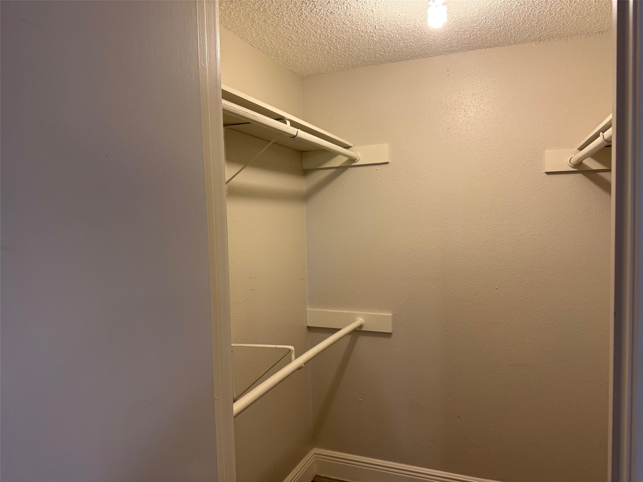 6701 Sands Point Drive, Unit 48 Houston, TX 77074 - Photo 19 of 30 a view of a room with racks on the wall