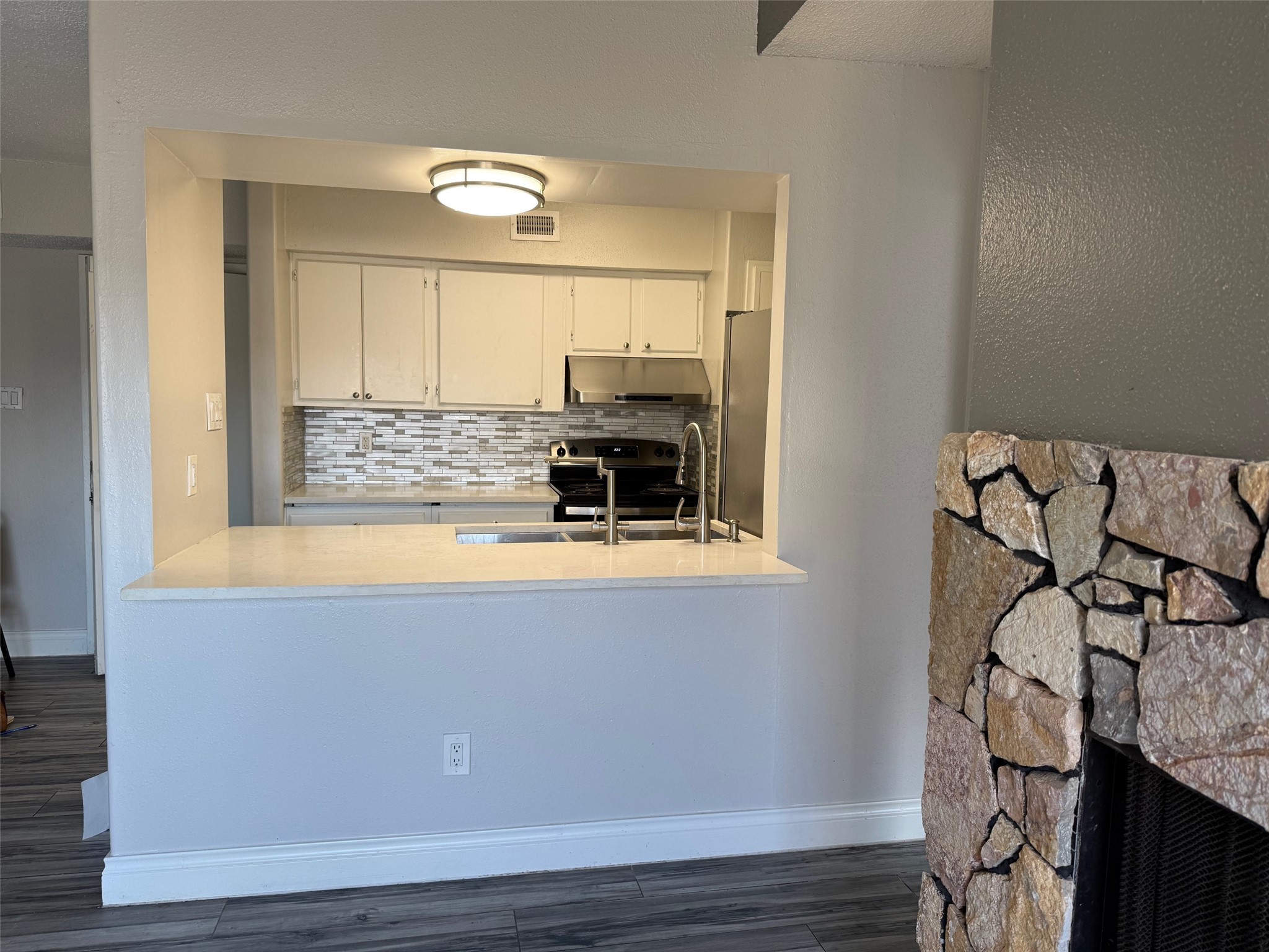 6701 Sands Point Drive, Unit 48 Houston, TX 77074 - Photo 5 of 30 a view of kitchen with wooden floor and windows
