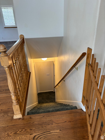 798 South 600 East Payson, UT 84651 - Photo 25 of 31 Wood-finish flooring leading to a carpeted staircase with a wooden handrail
