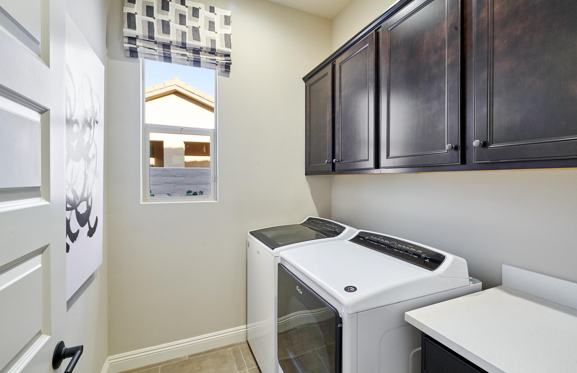 26 Zinfandel Rancho Mirage, CA 92270 - Photo 11 of 46 a utility room with dryer and washer