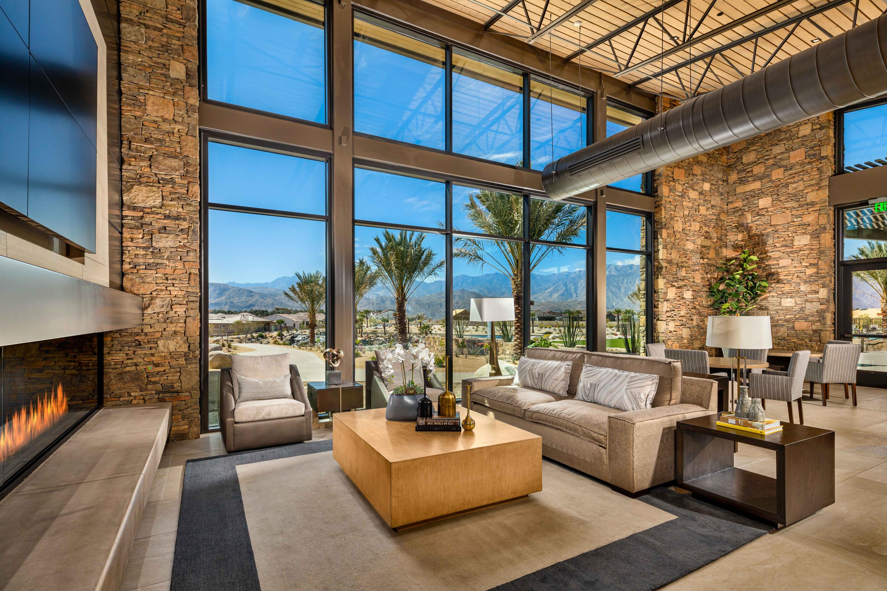 26 Zinfandel Rancho Mirage, CA 92270 - Photo 19 of 46 a living room with furniture a fireplace and large windows