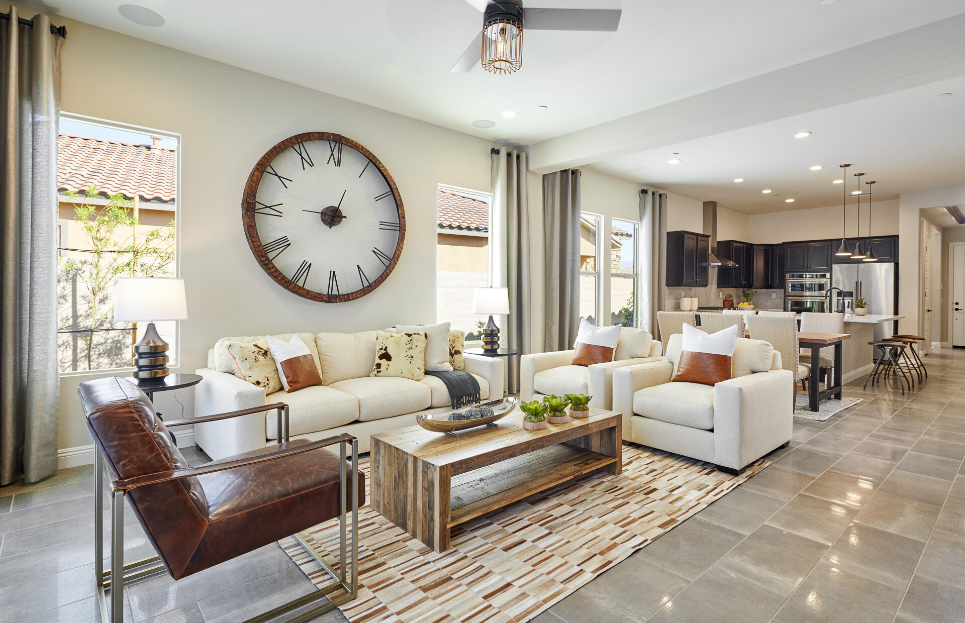 26 Zinfandel Rancho Mirage, CA 92270 - Photo 4 of 46 a living room with furniture a clock and a large window