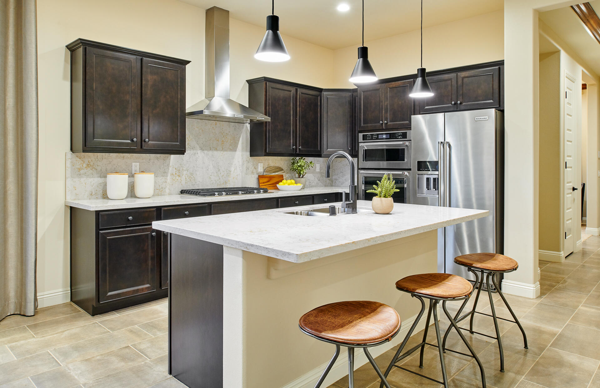 26 Zinfandel Rancho Mirage, CA 92270 - Photo 7 of 46 a kitchen with stainless steel appliances granite countertop a sink a stove a refrigerator and island with wooden floor