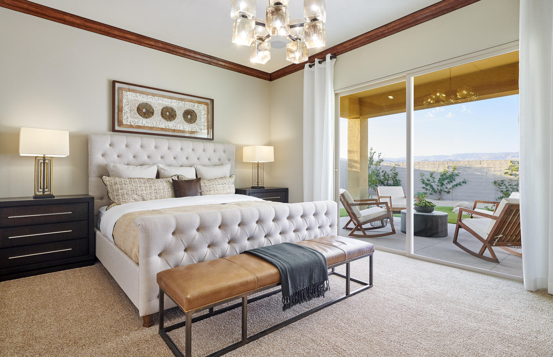 26 Zinfandel Rancho Mirage, CA 92270 - Photo 8 of 46 a bedroom with a large bed and a chandelier