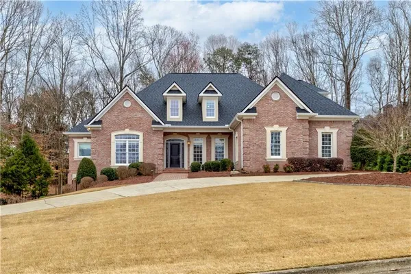 a front view of a house with a yard