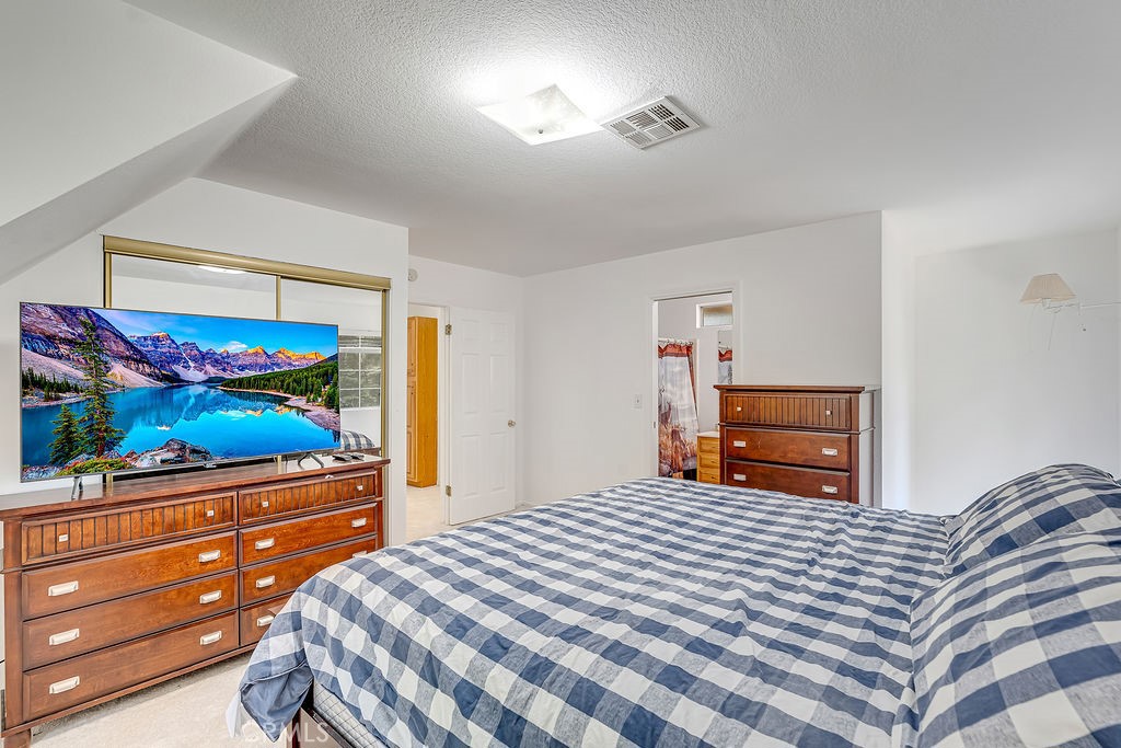 318 Old Toll Road Lake Arrowhead, CA 92352 - Photo 13 of 44 a bedroom with a bed and a television