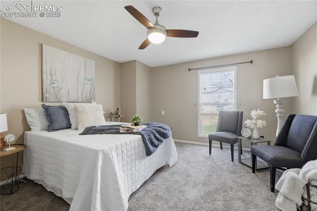 a bathroom with a granite countertop toilet a sink a mirror and a shower