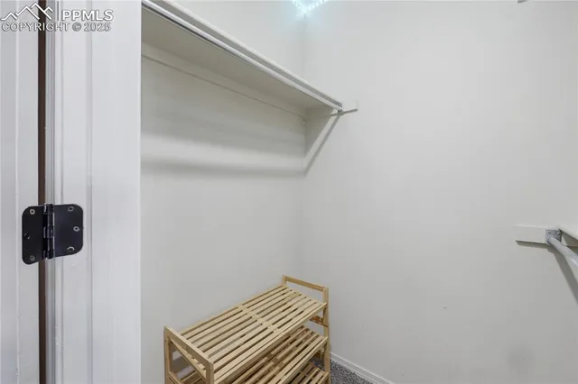 a bed room with a bed and a chair