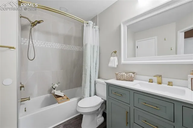 a bathroom with a toilet a sink and a mirror