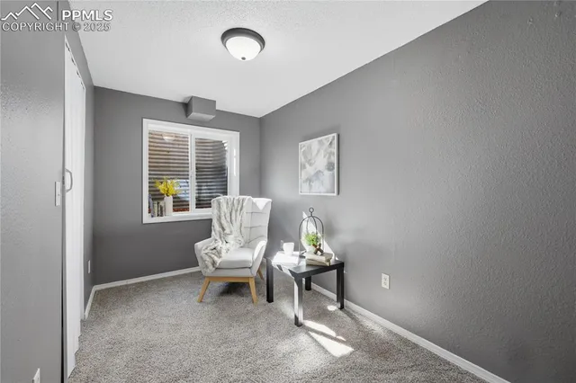 an aerial view of a house with a yard basket ball court and outdoor seating