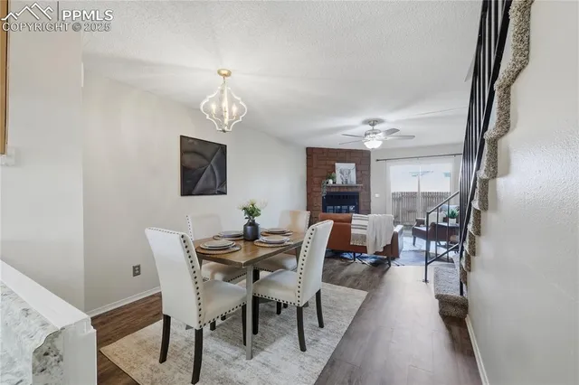a kitchen with a refrigerator and a stove top oven