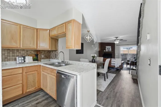 a kitchen with stainless steel appliances granite countertop a sink stove and a refrigerator