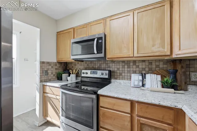 a view of a hallway with a livingroom and a couch