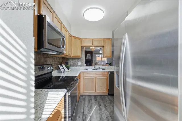 a living room with furniture potted plant and a window