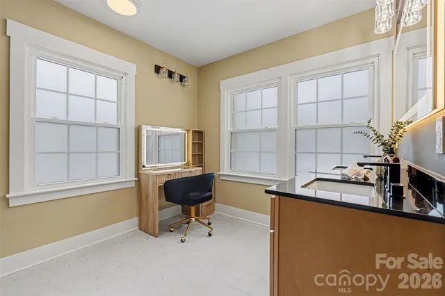 a workspace with furniture and window