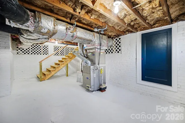 a view of a balcony with wooden floor and outdoor seating
