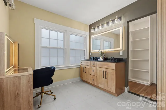 a kitchen with granite countertop cabinets and window