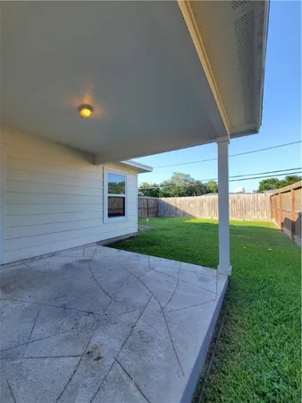a view of yard with swimming pool and green space