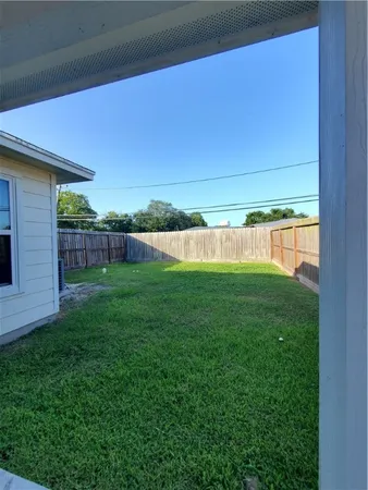 a view of a backyard with a garden and plants