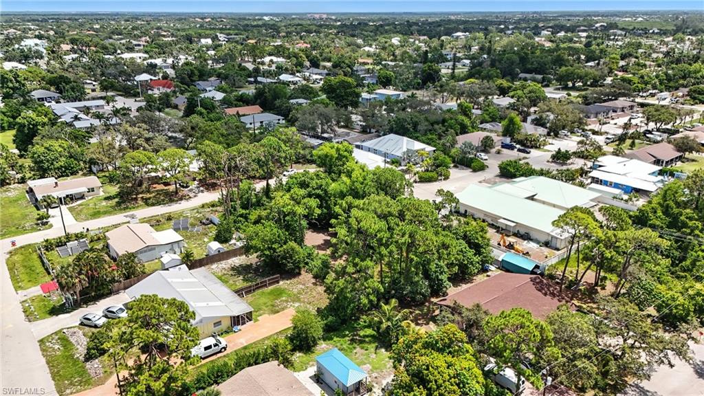 4295 Pine Lake Road Bonita Springs, FL 34134 - Photo 15 of 16 an aerial view of residential houses with outdoor space