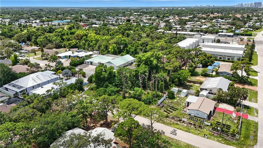 4295 Pine Lake Road Bonita Springs, FL 34134 - Photo 10 of 16 an aerial view of residential houses with outdoor space and trees