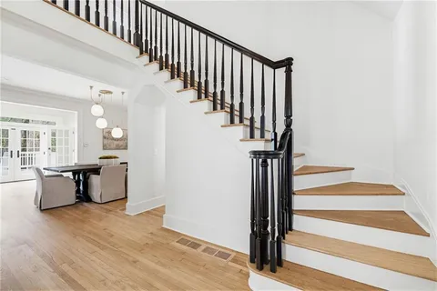 a view of an entryway with wooden floor