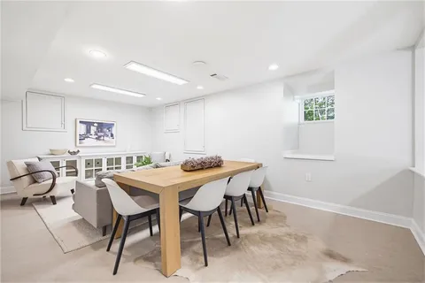 a room with white cabinets and a sink