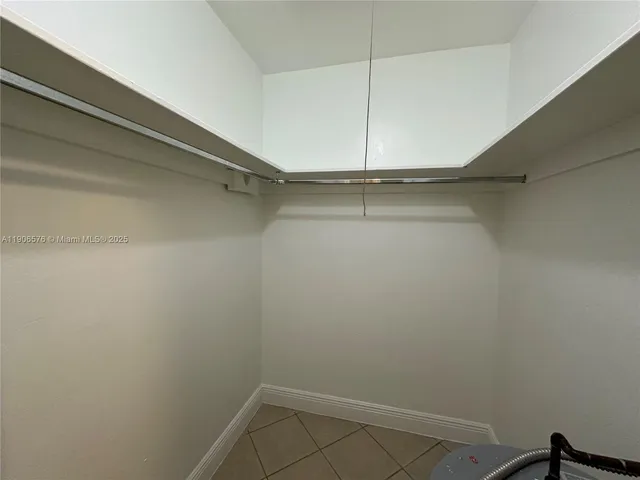 a bathroom with a sink and a window