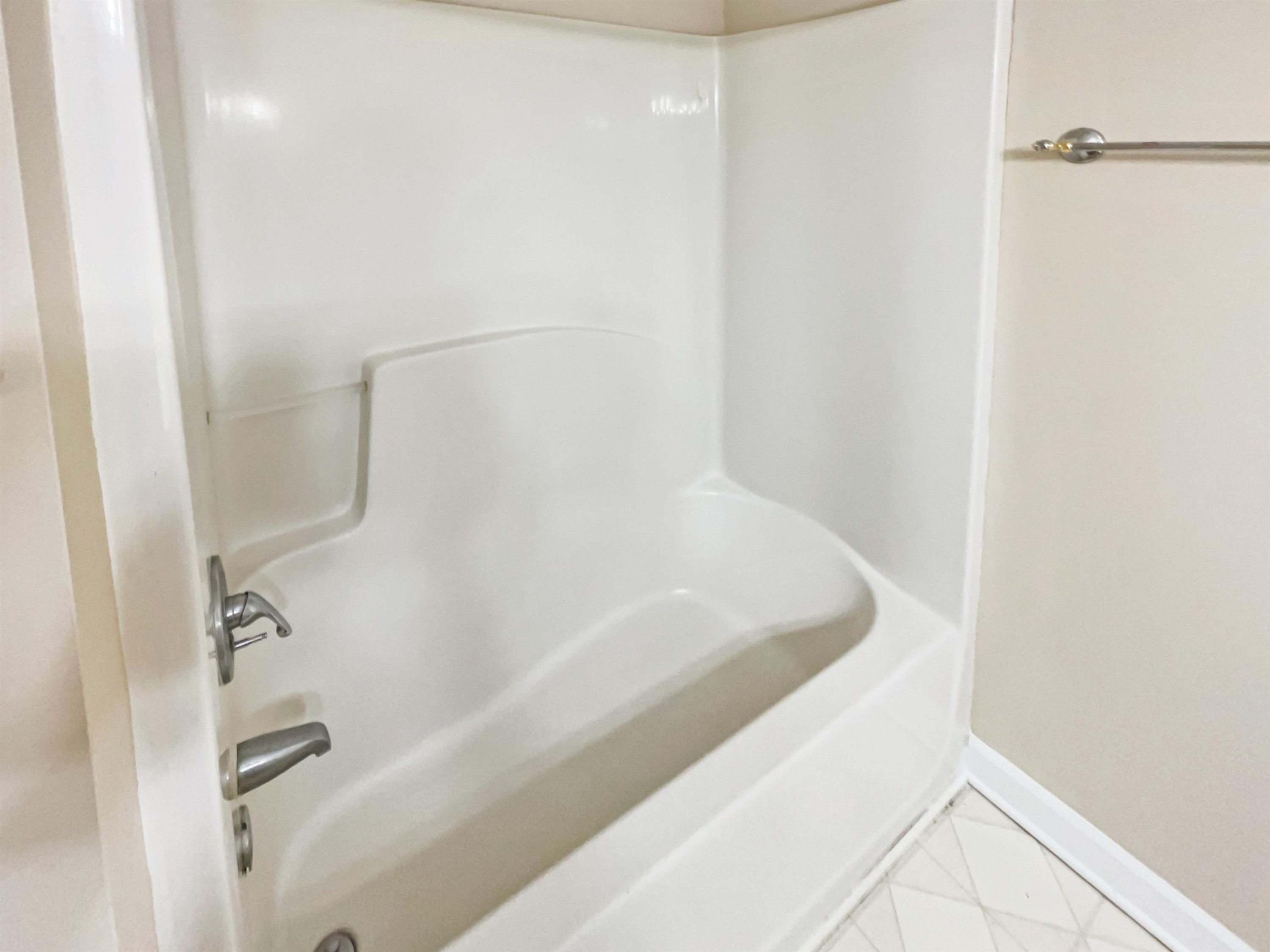 8401 Wolverton Fields Drive Wake Forest, NC 27587 - Photo 17 of 19 a bathroom with a bathtub