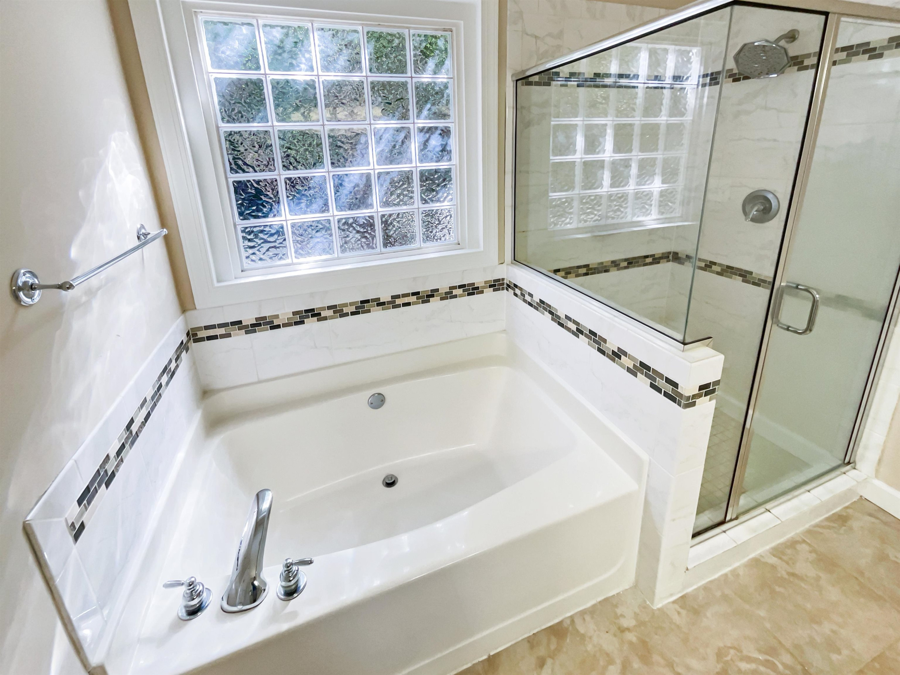 8401 Wolverton Fields Drive Wake Forest, NC 27587 - Photo 10 of 19 a bathroom with a tub and a shower