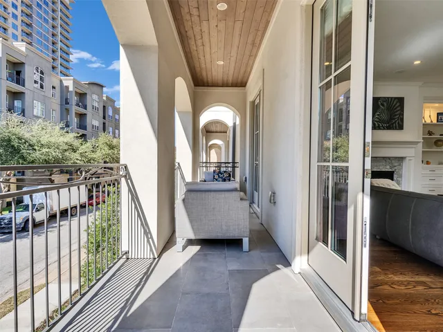a view of a livingroom with furniture window and wooden floor
