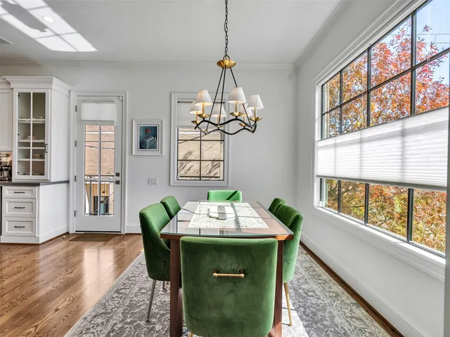 a kitchen with stainless steel appliances granite countertop a stove a sink and a white cabinets
