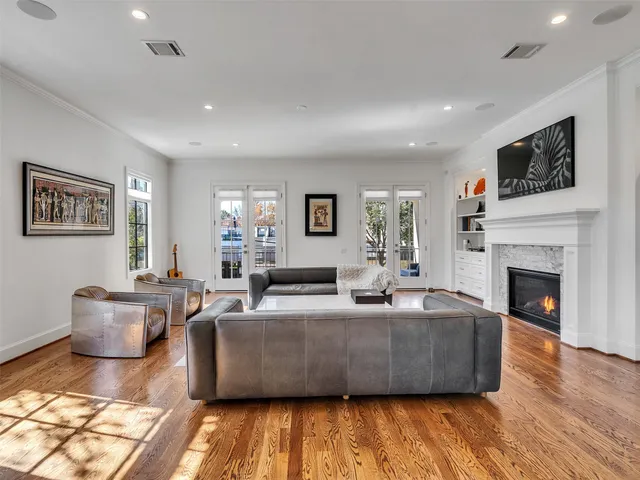 a living room with fireplace furniture and a flat screen tv