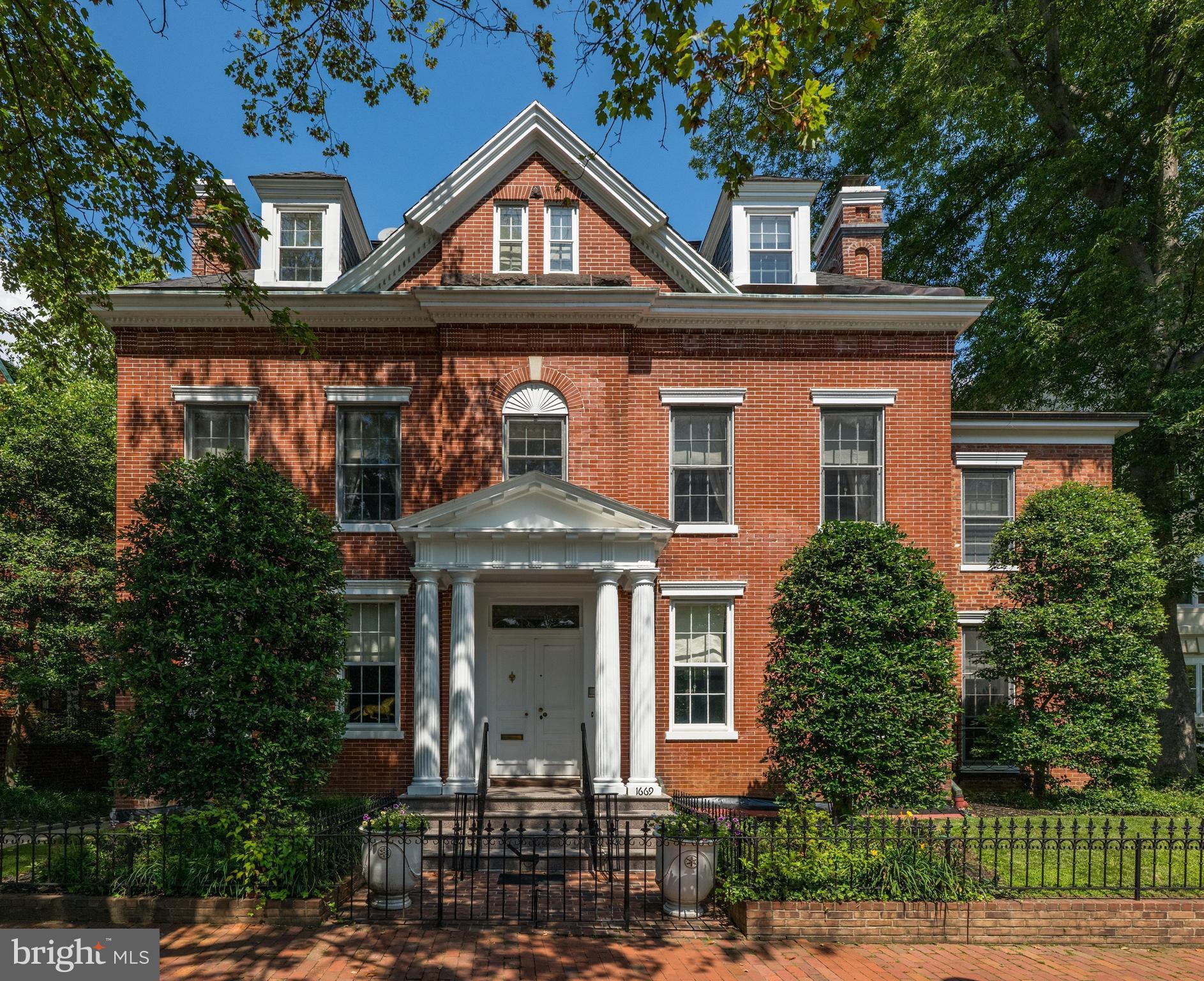 1669 31st Street Northwest Washington, DC 20007 - Photo 1 of 15 a front view of a house with garden